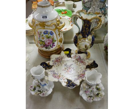 Handpainted twin handled vase, a floral painted lamp base, a pair of winged cherub decorated  eggcup stands and a decorative 