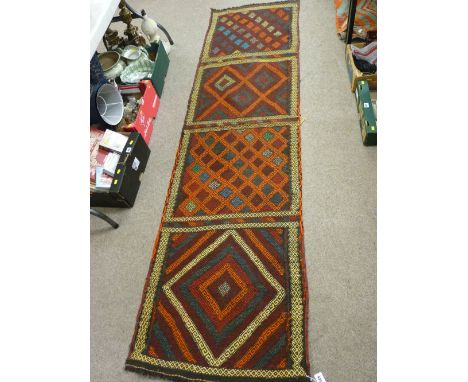 Suzni Kelim carpet runner, multi-coloured in four repeating block patterns with sectional borders, 258 x 71 cms