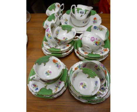 Nice quality vintage thirty plus piece teaset with green scale and floral decoration