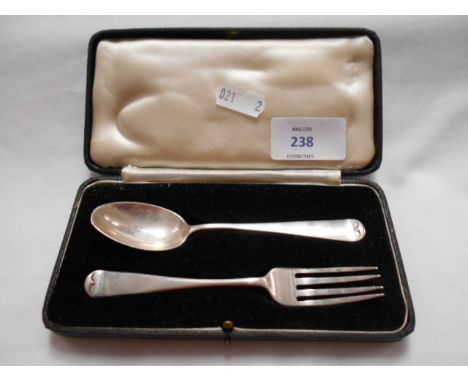 A cased silver christening set comprising spoon and fork dated London 1935