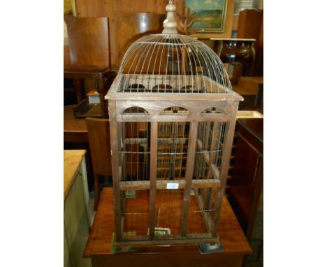 A 20th C Middle Eastern teak and wire ornamental bird cage of architectural dome shaped form