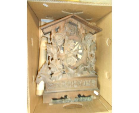 A Victorian black forest carved cuckoo clock surmounted with flowers and vines A/F 