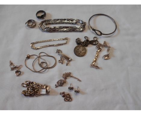 A selection of assorted silver jewellery items to include bangle, rings, chains, earrings, charm etc