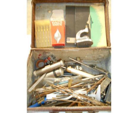 A collection of vintage watchmakers tools to include gauges, hammers, tweezers, screw drivers etc