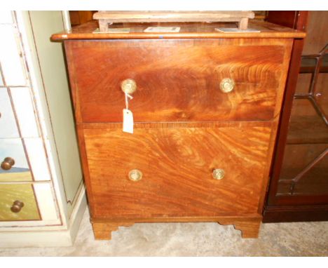 A Georgian walnut commode with brass drop ring handles and raised on bracket feet, since been converted to a cupboard