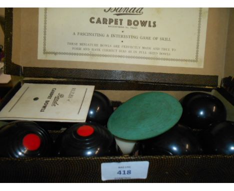 A boxed set of B & A 'Banda' carpet bowls