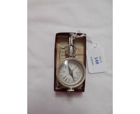A boxed 'The Rapid' opera and field glass with compass complete with instructions