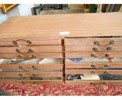 A twelve drawer watchmakers chest housing various spare parts and tools