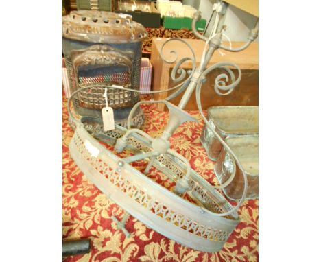A late Victorian oval copper ceiling light of scrolling form, with two branch light and pierced galleried shade with t-bar re