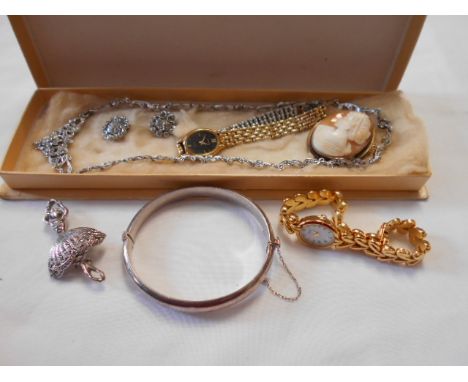 A selection of jewellery and watches to include cameo brooch, silver bangle etc