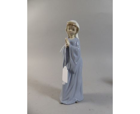 A Nao Figure of a Praying Girl, 28cm high 