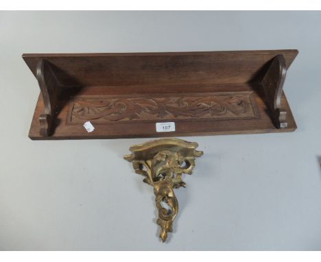 An Edwardian Mahogany Wall Shelf with Blind Carved Panel, 55cm wide Together with an Italian Gilt Decorated and Pierced Sconc