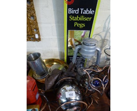 A Tray of Metal Wares to Include Owl and Snail Ornaments, Post Office Money Box, Hurricane Lamp, Silver Plated Casters