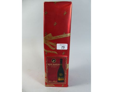 A Wrapped Bottle of Remy Martin Fine Champagne Cognac  