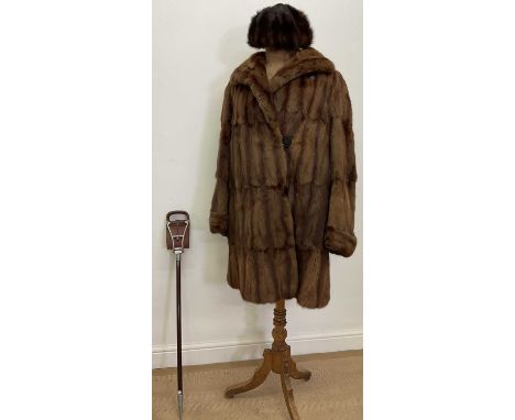 A mid century fur coat, a mink trimmed hat and a shooting stick, perfect for a day at the races