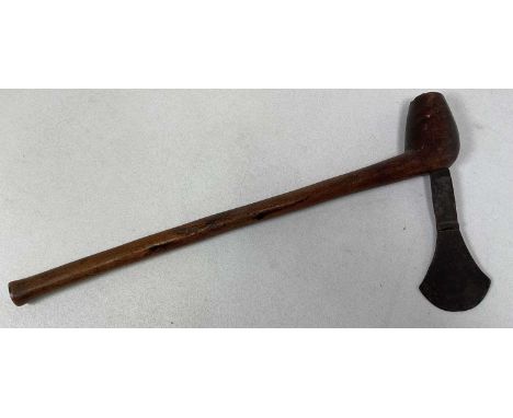 A late 19th/early 20th century South Seas axe, with simple wooden shaft and shaped iron blade, length 52cm.
