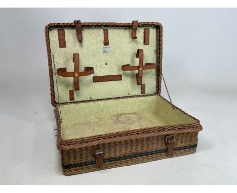 HARRODS; a wicker hamper with metal carrying handle, height 19cm, width 65cm, depth 45cm.