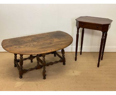 A mahogany occasional side table with single drawers, height 74cm, with an Ercol oak gate leg coffee table, height 49cm, diam
