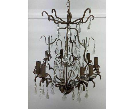 A chandelier with metal and glass decorations together with four metal decorative wall sconces, also with a modern twelve bra