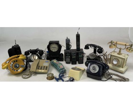A quantity of telephones to include a bakelite, an Art Drco 'Hamilton' mantel clock, a 1930s telephone, a Swatch phone, and e