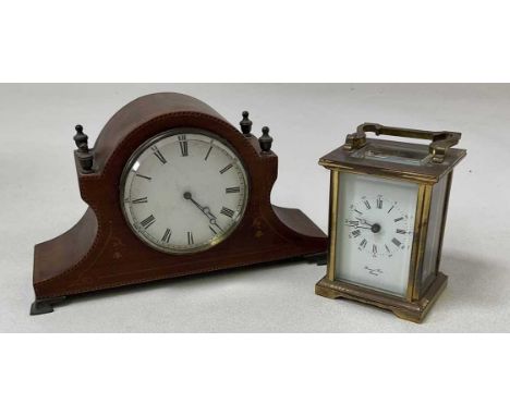 An Edwardian mahogany chevron strung and inlaid mantel timepiece, length 24cm, and a brass cased carriage clock with Roman nu
