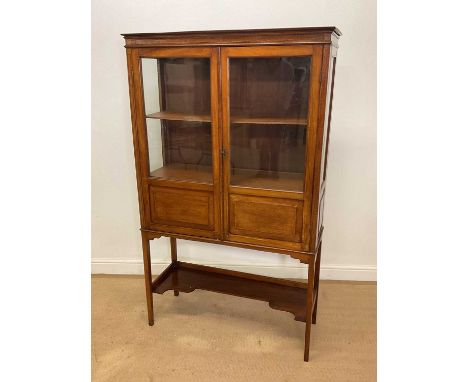 An early 20th century mahogany inlaid display cabinet glazed to the front and sides, height 162cm, width 98cm, depth 35cm.Con