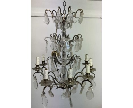 A French brass and clear cut glass chandelier, length of drop approx 80cm. N.B. Please note the light fitting was recently re