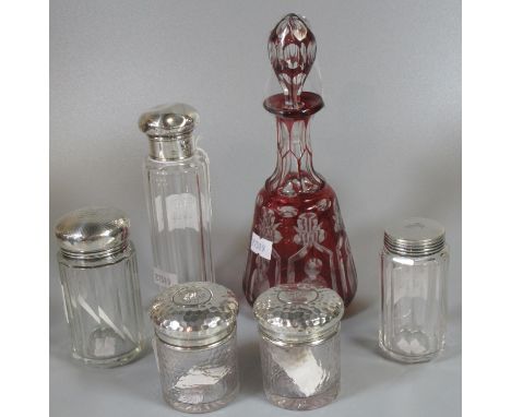 Collection of five silver-topped glass dressing table jars, together with a ruby flash cut, mallet-shaped vinegar bottle and 