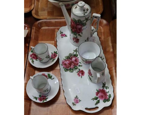 Rose design china part coffee set to include; two coffee cans and saucers, milk jug, sucrier, coffee pot and rectangular tray