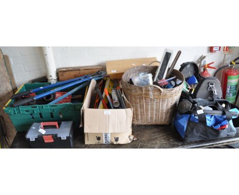 Large collection of assorted tools to include; saws, spirit levels, pliers, sheers, spanners, wicker basket with accessories,