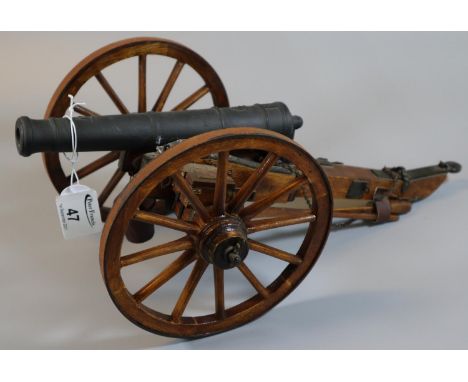 Wood and cast metal scale model of a British 9 pound field artillery cannon, probably Napoleonic War. 36cm long approx. (B.P.