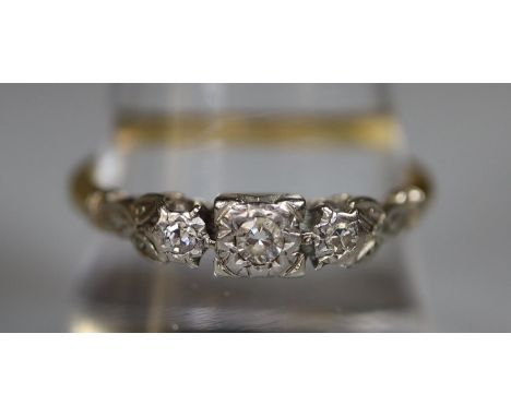 Yellow metal three stone diamond ring.  Ring size R.  Approx weight 3.5 grams.(B.P. 21% + VAT) 