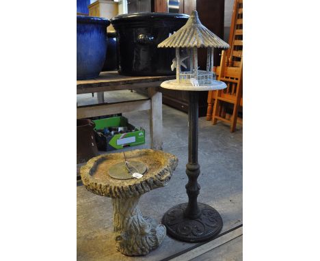 Modern composite pedestal garden stand with metal sundial.  Together with a bird house/bird feeder on cast iron base. (2)(B.P