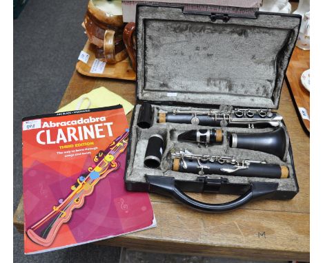 Cased clarinet by H-Couf, together with an Abracadabra clarinet song and tune book. (2)(B.P. 21% + VAT) 