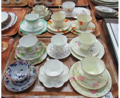 Two trays of collectors' cups and saucers and trios to include: two Alfred Meakin trios decorated in Art Deco style, a green 