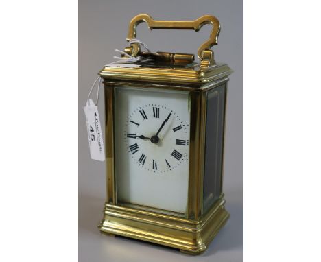 French brass carriage clock with full depth Roman face. (B.P. 21% + VAT) Lacks original gilding, includes key, winds and tick