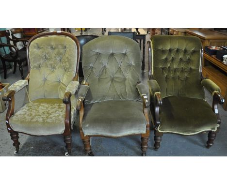 Three similar Victorian button back upholstered fireside armchairs, all standing on baluster turned feet and casters. (3)(B.P