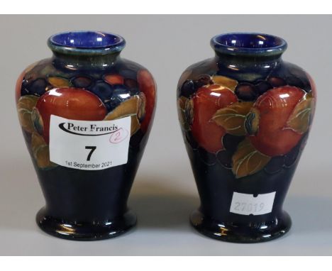 Pair of Moorcroft art pottery tube lined pomegranate vases of baluster form, 10cm high approx, impressed marks to the base 'M