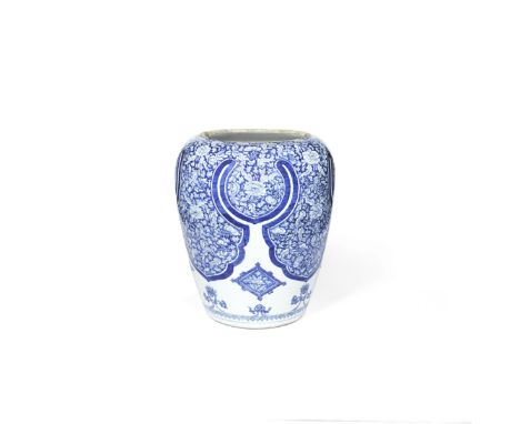 A LARGE BLUE AND WHITE JARKangxiDecorated with pendant foliate lappets reserved with a profusion of peony sprays and entwined