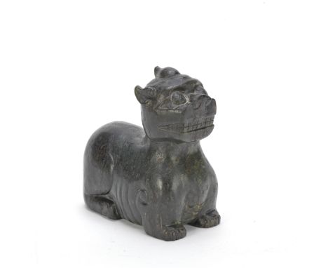 AN ARCHAISTIC SPINACH JADE CARVING OF A BIXIELate Qing DynastyThe recumbent beast resting on its muscular legs, the dragon he