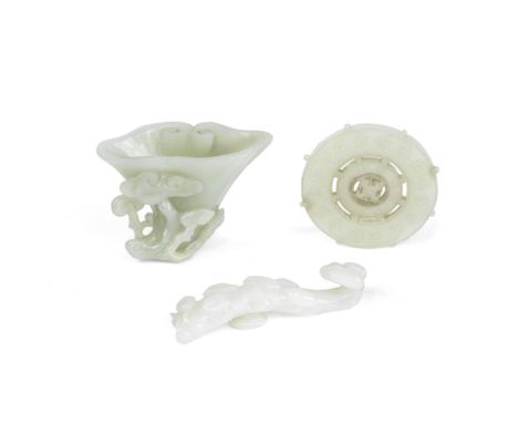 A GROUP OF THREE JADES18th/19th centuryComprising: a pale green jade lingzhi washer carved in relief with smaller lingzhi ste