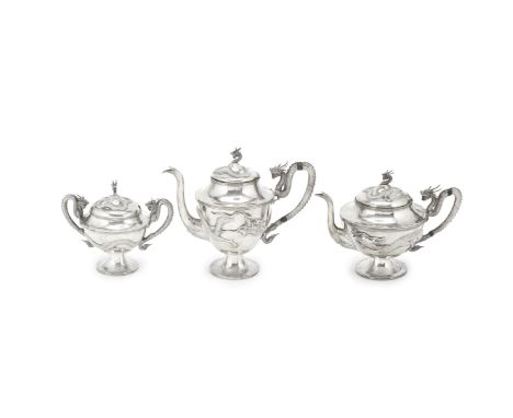 AN EXPORT THREE-PIECE SILVER TEA SERVICEMark of MH, Canton, 19th centuryComprising a teapot, a tea pot and a two-handled suga