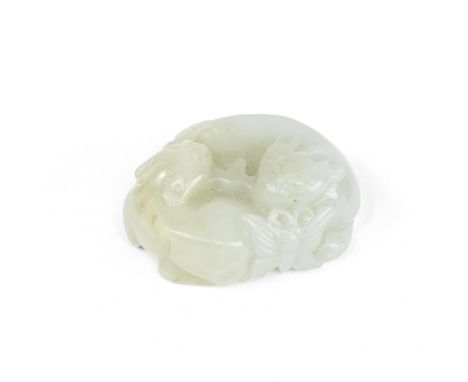 A PALE GREEN JADE 'CATS AND BUTTERFLY' GROUP19th centuryModelled as two recumbent felines curled around nose to tail, graspin