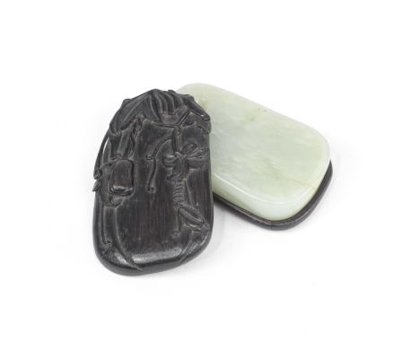 A PALE GREEN JADE INKSTONE19th centuryThe jade shaped as an irregular inkstone with a flattened centre and an oval well to th