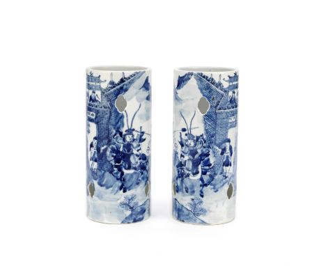 A PAIR OF BLUE AND WHITE MIRROR IMAGE HAT STANDSLate 19th/early 20th centuryEach of cylindrical shape painted with horsemen a
