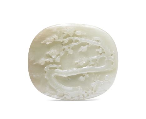 A PALE GREEN JADE 'PRUNUS' PLAQUE19th centuryThe oval-shaped plaque carved in relief with a blossoming  prunus tree issuing f