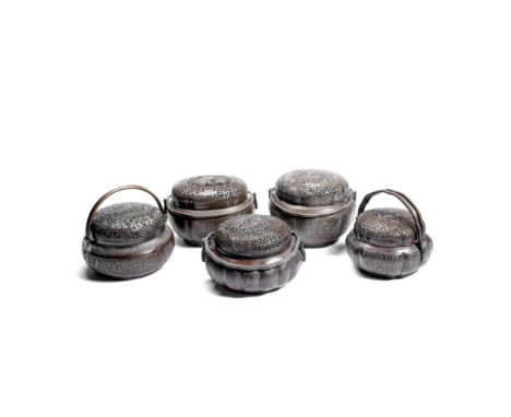 A GROUP OF FIVE COPPER ALLOY HAND WARMERS AND COVERS19th centuryEach with twin-hinged handles, decorated with embossed archai