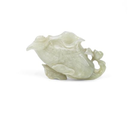 A PALE GREEN JADE 'LOTUS' VESSEL18th centuryIn the shape of a large lotus leaf issuing from coiled stems with lotus buds and 