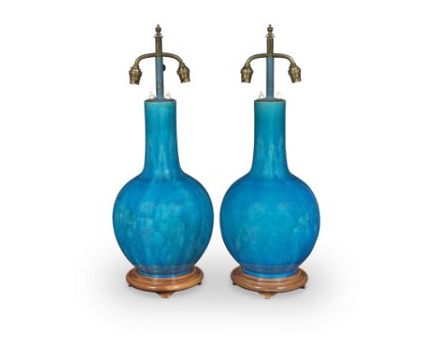 A PAIR OF TURQUOISE-GLAZED BOTTLE VASESLate Qing Dynasty/RepublicEach rising from a short foot to a large globular body surmo