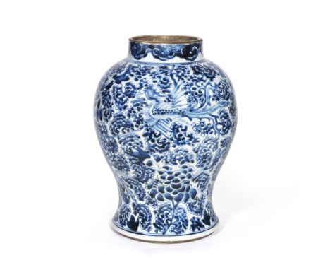 A BLUE AND WHITE 'PHOENIXES' JARKangxiThe baluster form jar painted with four phoenixes amongst a continuous peony scroll bel